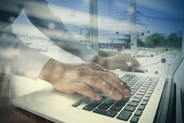 double exposure of businessman hand working with business documents on office table with laptop computer with social media diagram